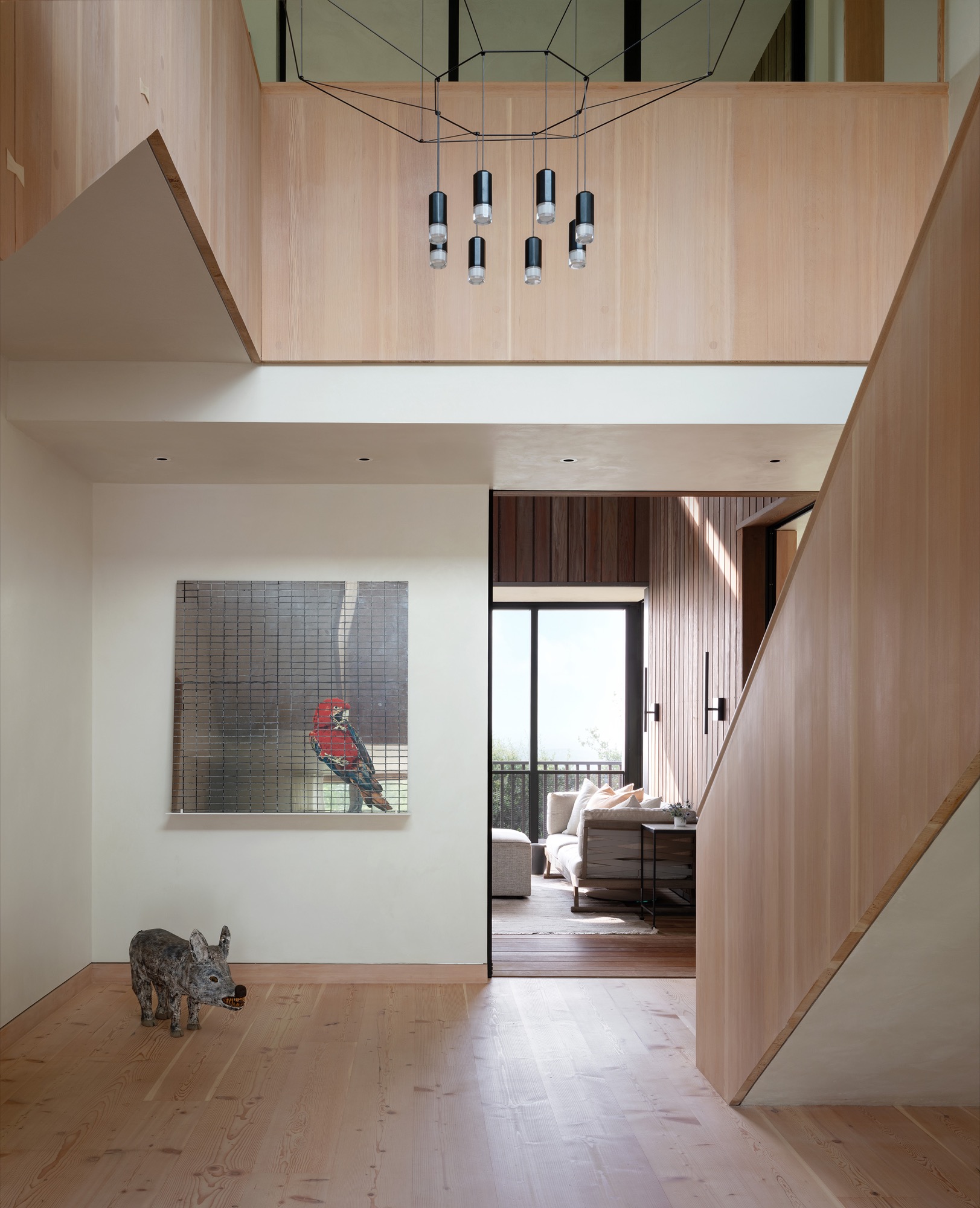 Hillside House double-height wood entry in West Lake Hills, Texas